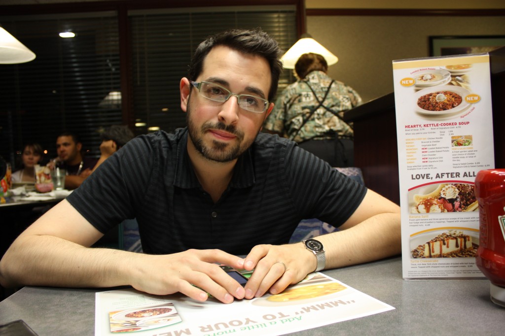 My husband at a Denny's in Plantation, Florida, in the middle of the night. He is unhappy. 